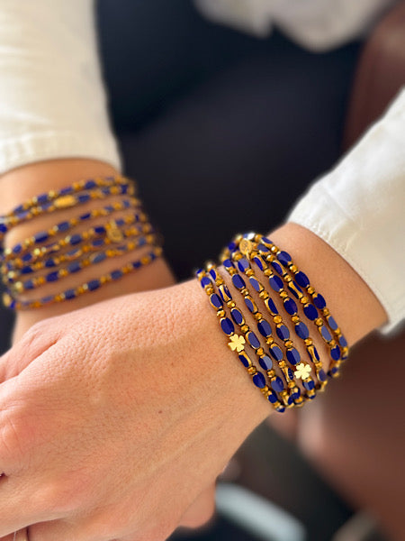 Détail du sautoir Indigo Solaire Trèfles Dorés en perles ovales indigo bleu-violet et trèfles dorés FAIS PAS TA STEPH